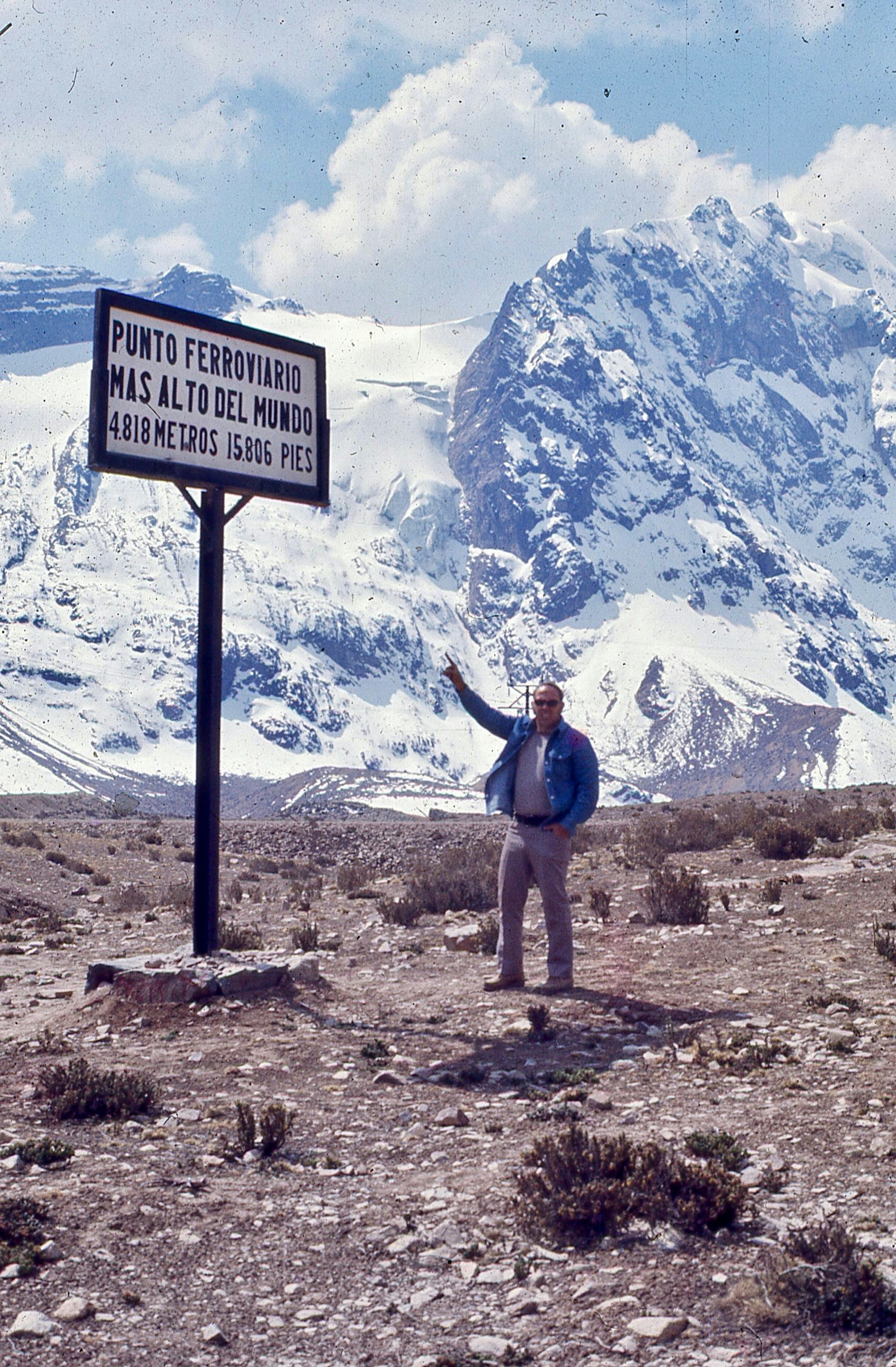 man standing near snow mountain